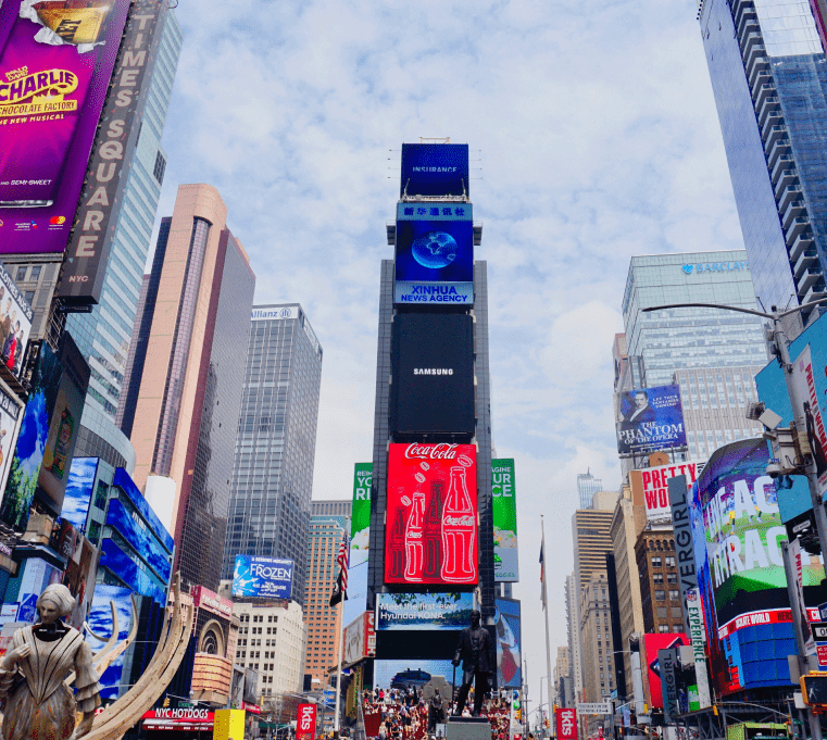 ny-billboard Vibrant Times Square scene with digital billboards and bustling crowds.