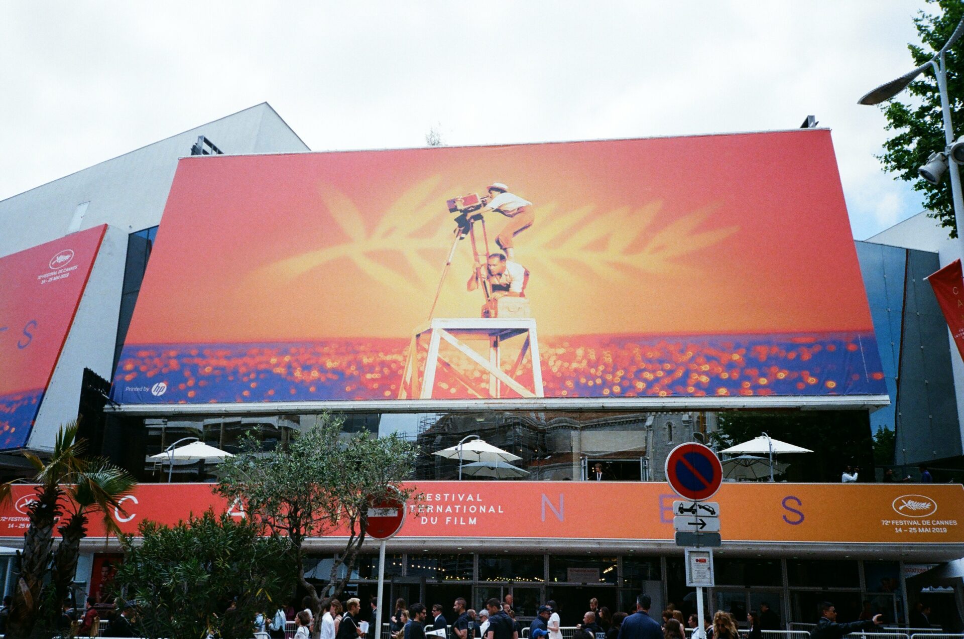 Sunset cityscape featuring a large digital billboard advertisement