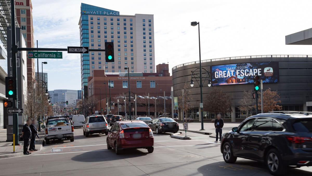 Digital out-of-home billboard displayed along a busy street in Colorado