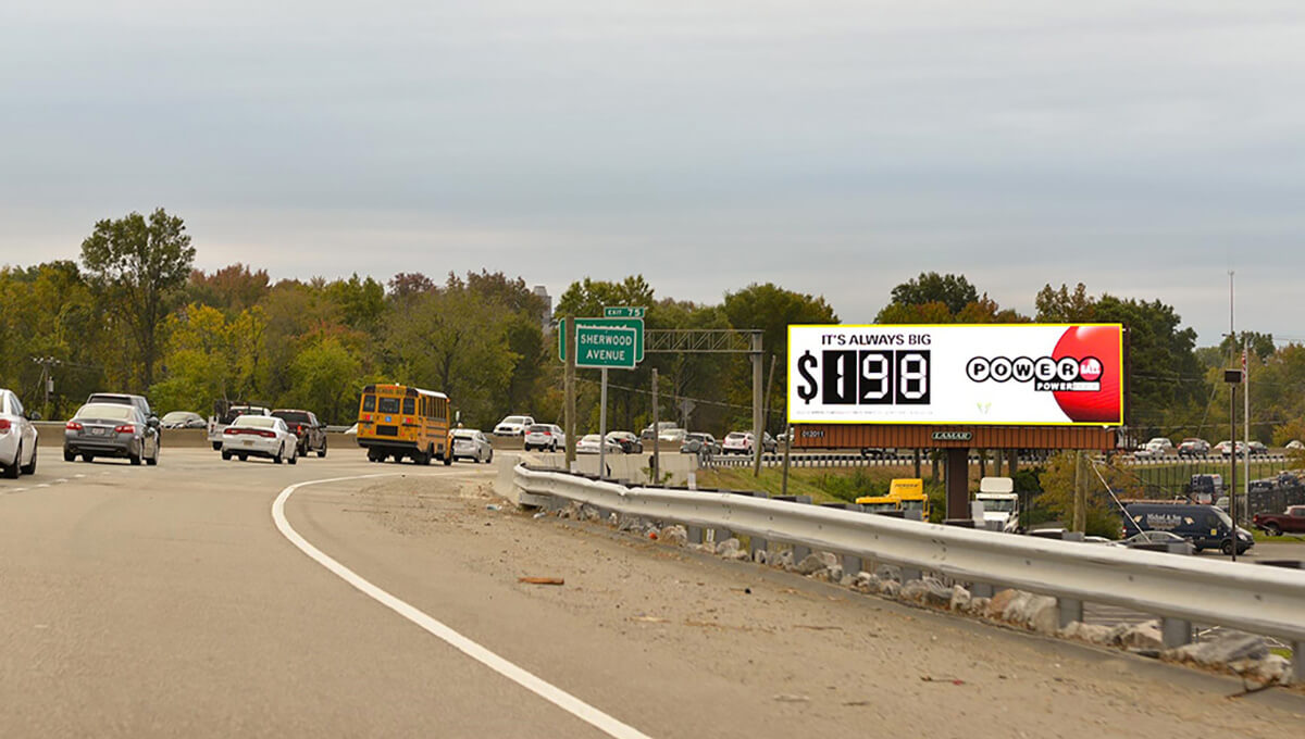 Digital out-of-home billboard displayed along a roadway in Virginia