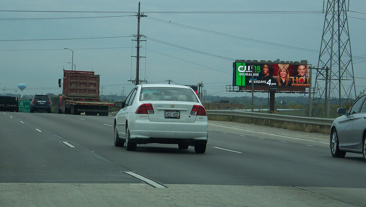Digital out-of-home billboard displayed along a roadway in Wisconsin
